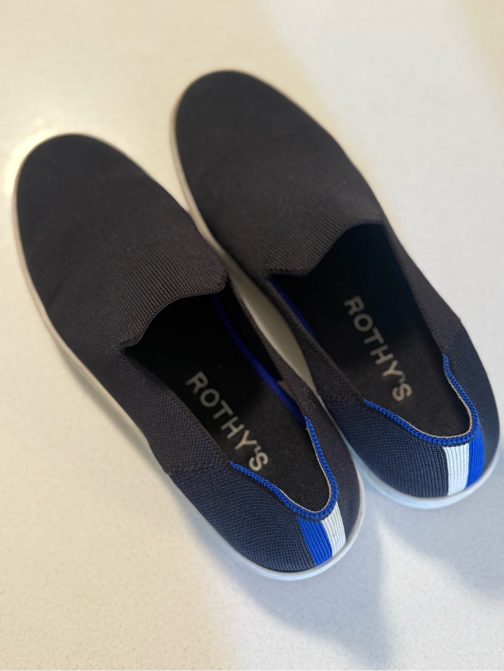Rothy's Women’s Slip-On Knit Sneakers — Navy with Blue & White Accent